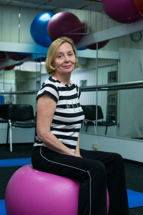 Woman with thoracic osteochondrosis after exercise therapy